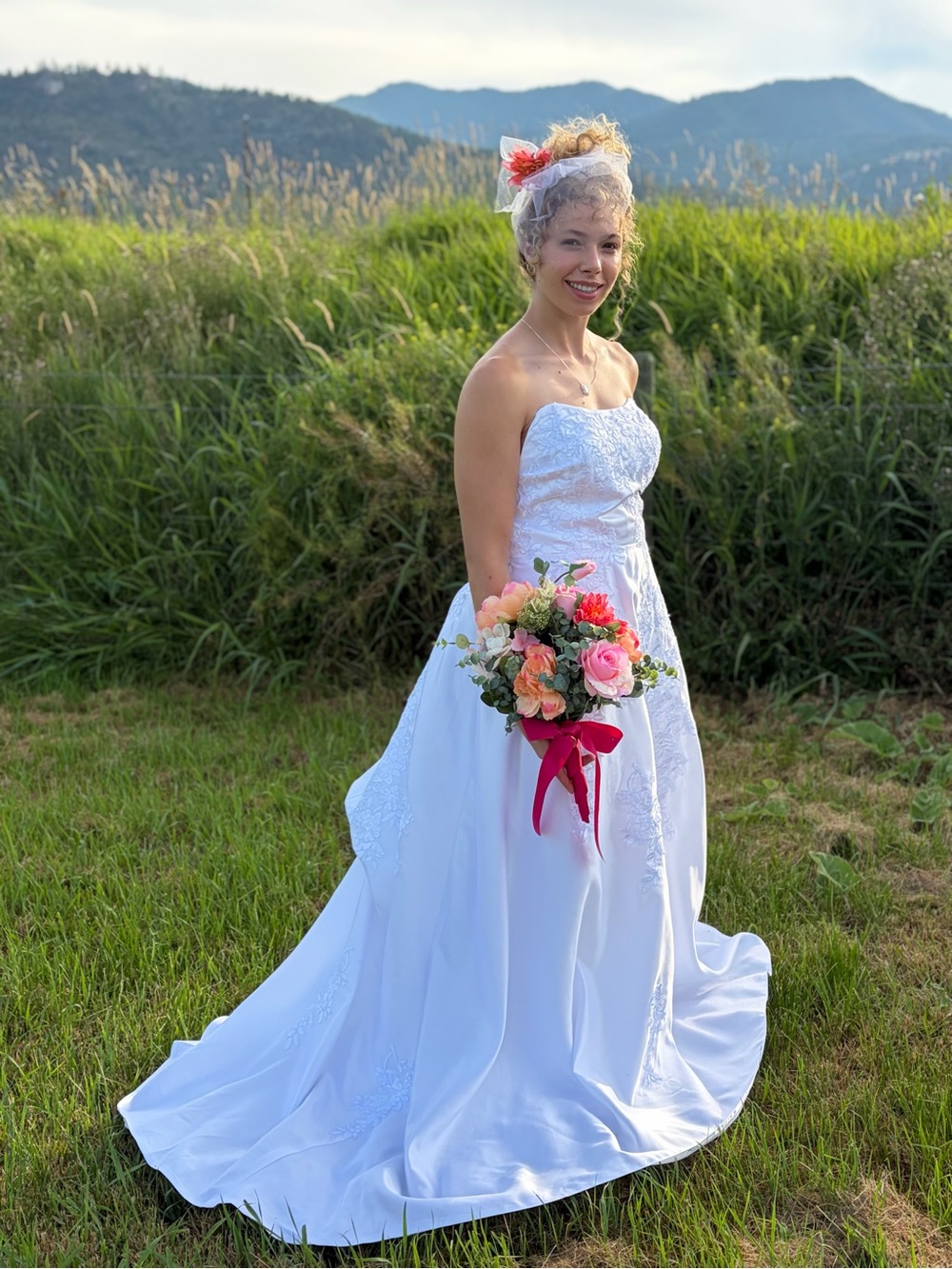White Off-Shoulder Lace Wedding Dress with Floral Bouquet - Picture 3 of 3